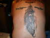 Feather with Braves Face tattoo