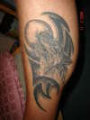 Wolf howling at moon tattoo