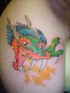 start of dragon half sleeve tattoo