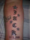 old english with stars forearm tattoo