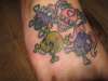 skulls reppin him and his family tattoo