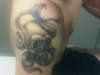 snake around skull tattoo