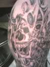 Skull In Torn Skin tattoo