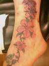 flowers onfoot tattoo