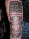 Tribal statue tattoo on forearm tattoo