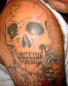 one of many skulls tattoo