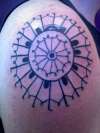 pin wheel tattoo
