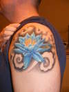 Lotus flower with grasshopper tattoo