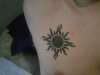 Right chest tribal sun tattoo