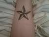 Right wrist nautical star tattoo
