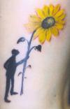 man with sunflower tattoo