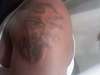 ripped demon tat tattoo