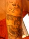 skull (bullet in head) tattoo