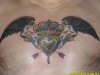 Wings wth heart and hands tattoo