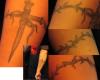 wood cross/thorn arm band tattoo