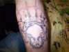 skull head with crown tattoo