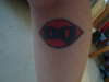 "DQ" tattoo