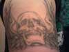 Skull with wings tattoo