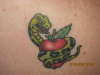 Snake around apple tattoo