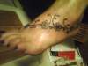 caries foot tattoo