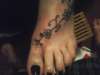 caries foot tattoo