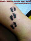 Baby feet stamp tattoo