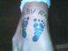 Daughters footprints tattoo