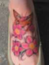 Tiger butterfly and flowers tattoo