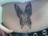 Butterfly with face tattoo