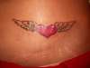 Flying heart tattoo