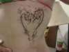 Heart with flowers on my ribcage. tattoo