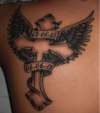 cross with wingzzz tattoo