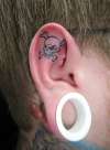 ear skull tattoo