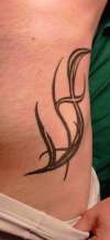 tribal side tattoo