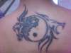 tribal yin-yang tattoo