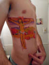 yellow christ tattoo