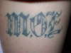Money over Everything on ma thigh tattoo