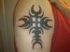 Right arm cross tattoo