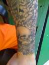 Skull wrist piece tattoo