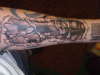 biomech forearm tattoo