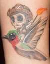 hummingbird with skeleton creature tattoo