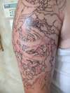 Right arm outline tattoo