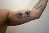 Swallows & Roman Numerals tattoo