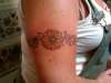 sunflower and sweetpea arm band tattoo