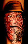Freddy has Kitty Dinner tattoo