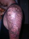 koi,lotus, and skulls quarter sleeve tattoo