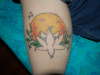 lotus blossom in front of moon tattoo