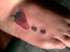 strawberry with ants right foot tattoo