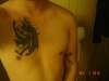 Dragon with cape tattoo