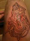 tribal demon head tattoo